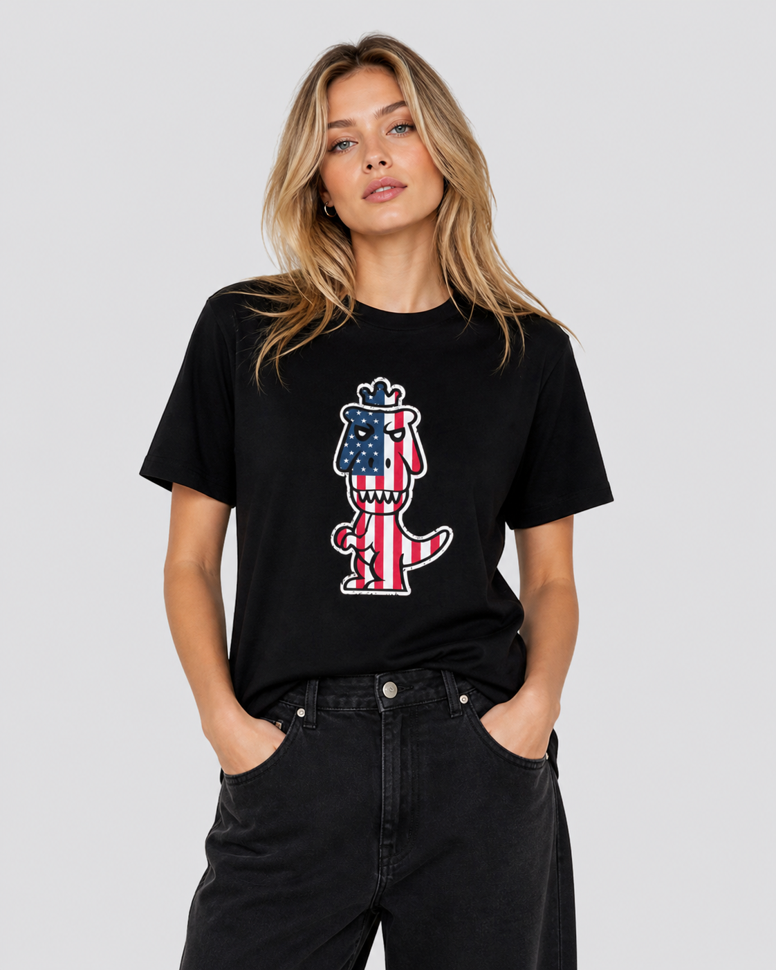 Woman wearing black Regno T-Rex Libertatem pima cotton tee with red white and blue American flag T-Rex graphic, female lifestyle shot