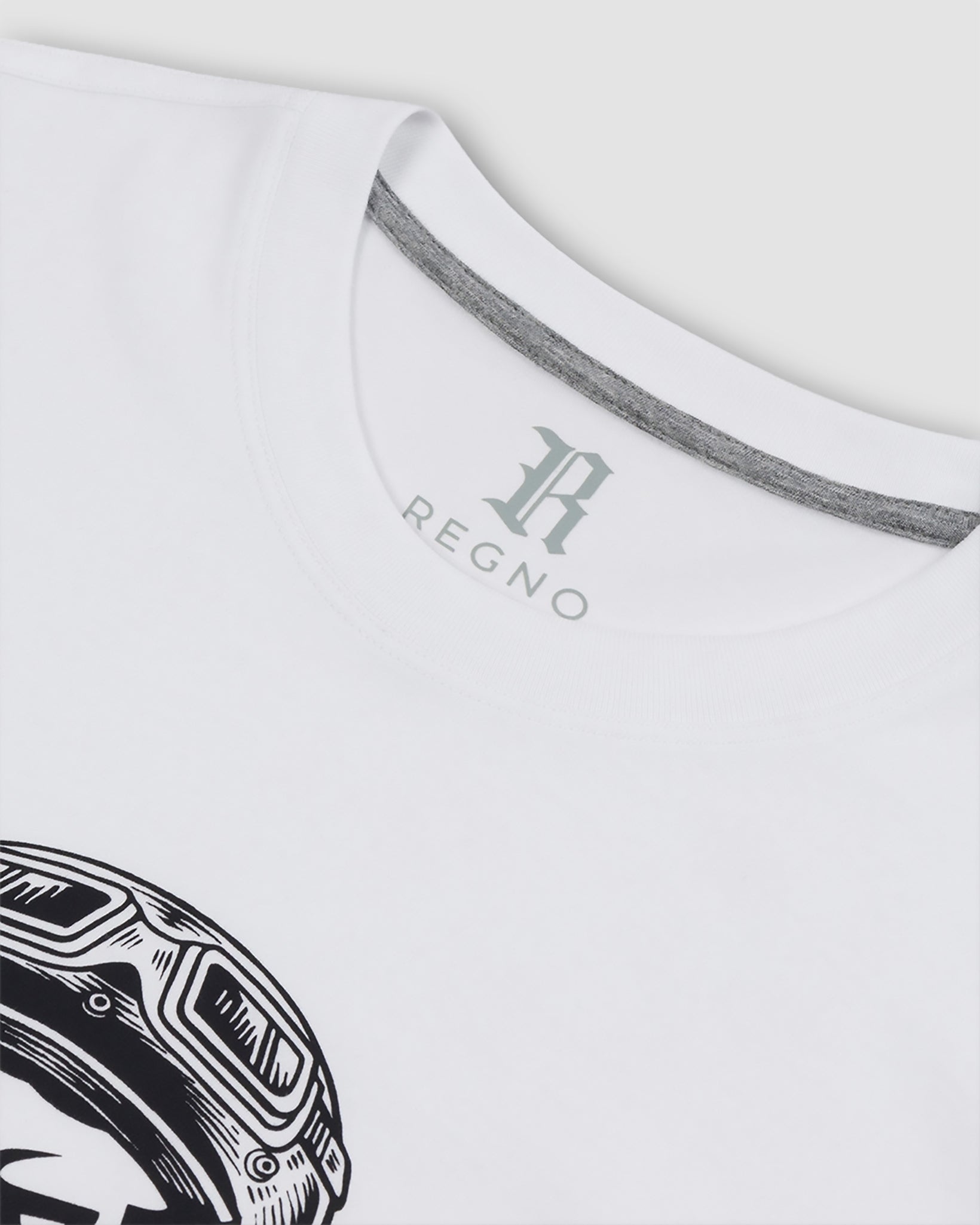 Close-up of black racing helmet T-Rex graphic on white pima cotton t-shirt by Regno, detail shot