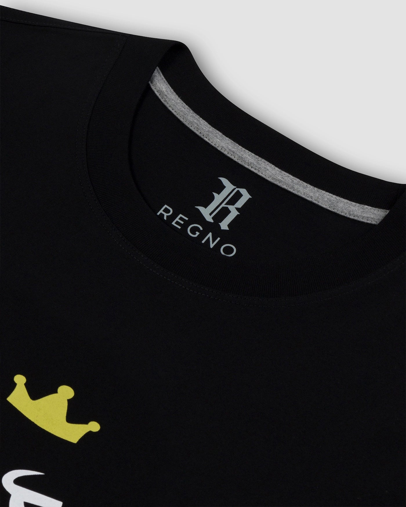 Close-up of lime green T-Rex graphic with black stripe on black pima cotton t-shirt by Regno, detail shot
