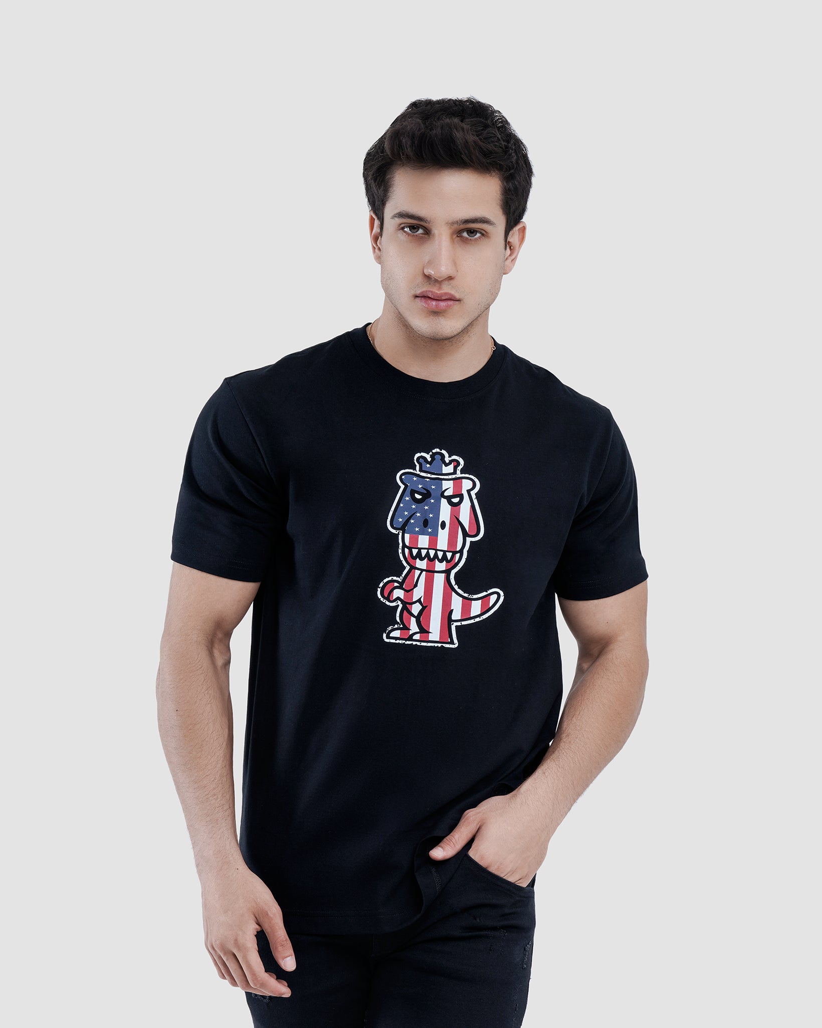 Man wearing black Regno T-Rex Libertatem pima cotton graphic tee with Americana design, upper body shot