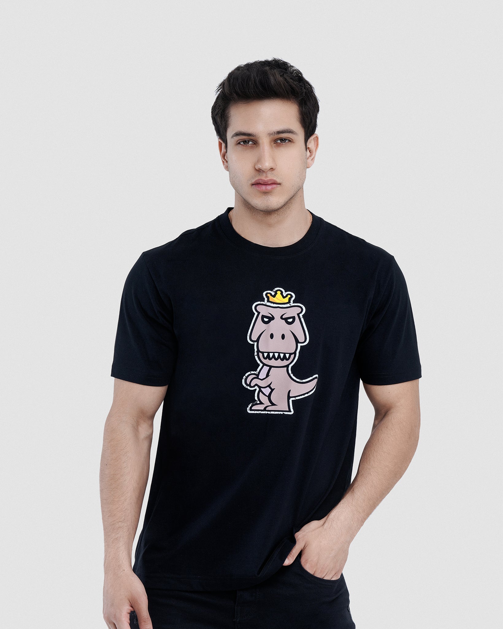 Man wearing black Regno Nudus pima cotton luxury graphic tee with minimalist T-Rex design, upper body shot