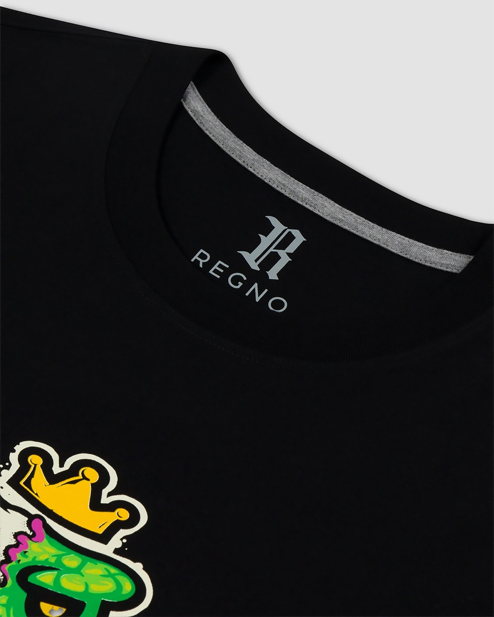 Close-up of neon green skeleton punk T-Rex graphic on black pima cotton t-shirt by Regno, detail shot