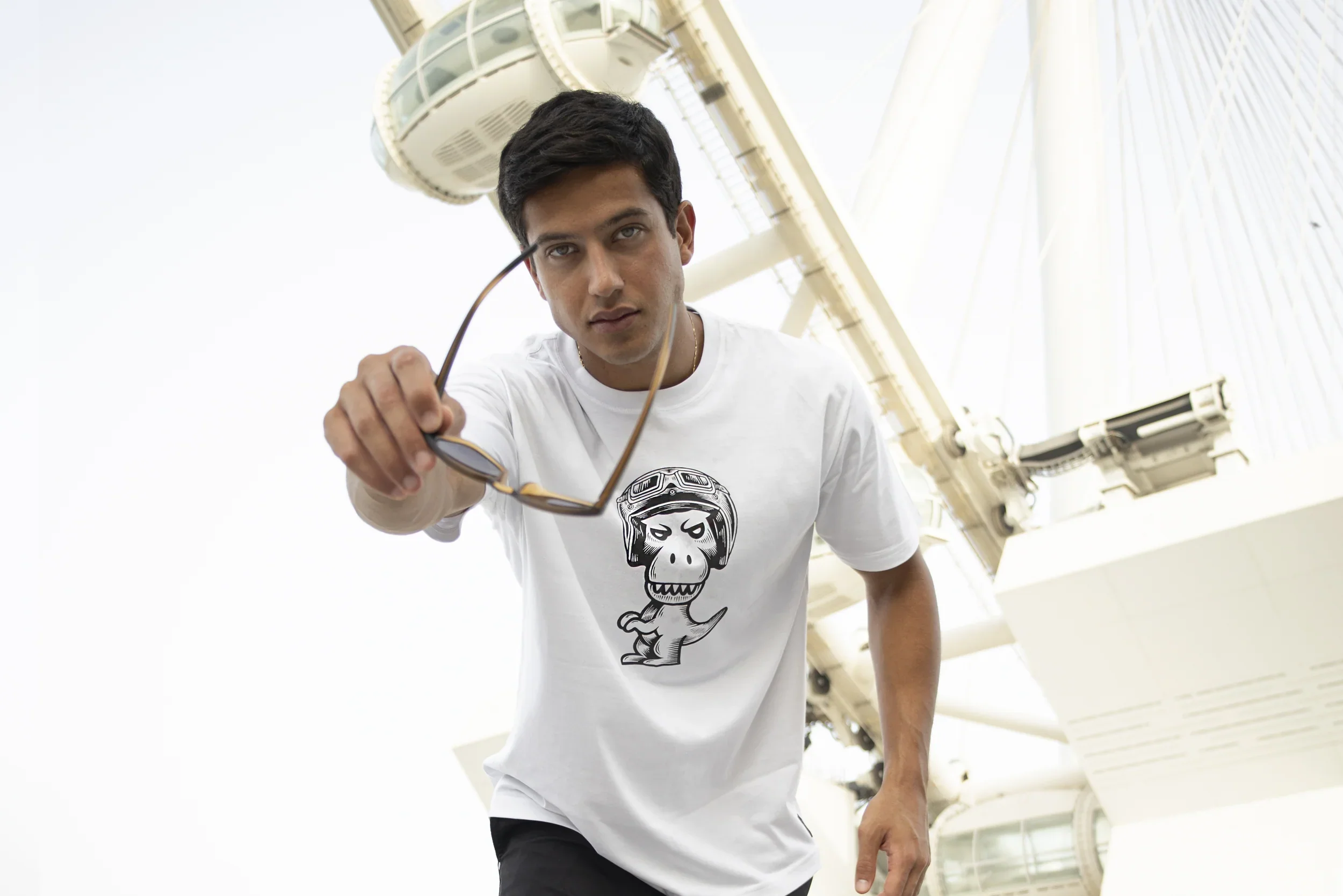 Collection of Regno limited edition pima cotton graphic t-shirts for summer 2026 including T-Rex designs in navy black and white