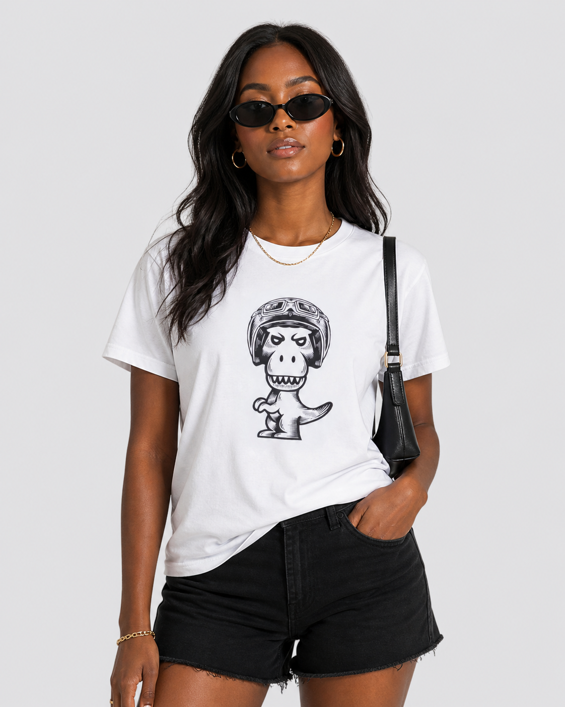 Woman styling white Regno T-Rex Birota pima cotton tee with black denim shorts and leather bag, NYC streetwear female outfit