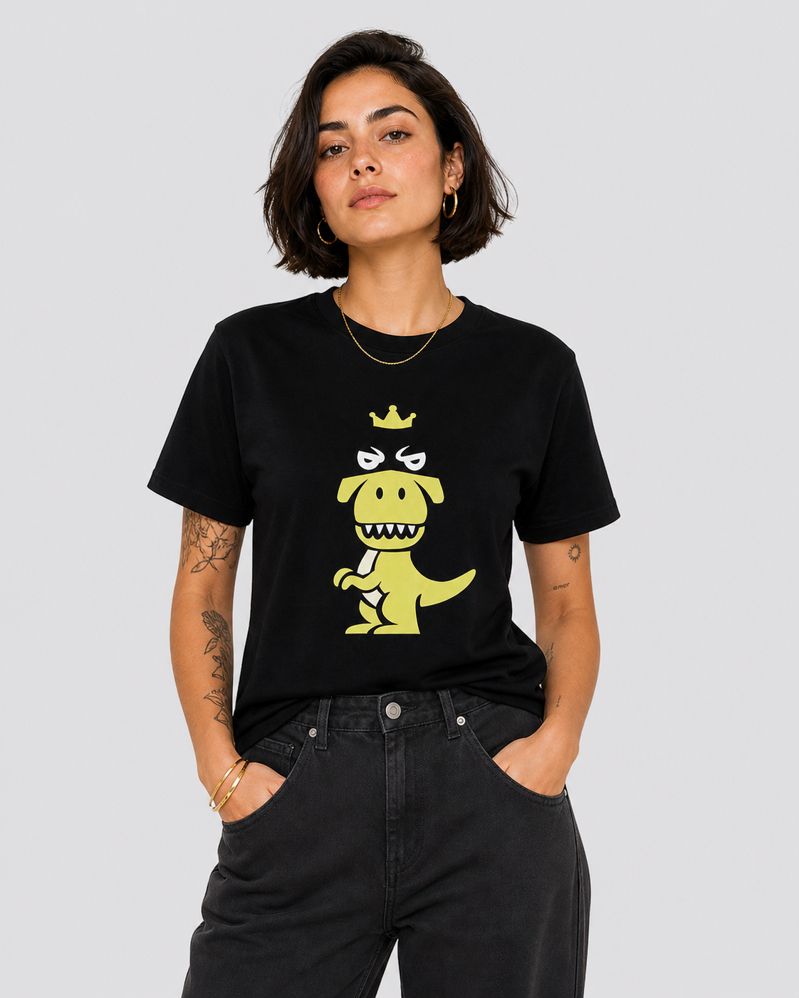 Woman wearing black Regno T-Rex Latro pima cotton tee with lime green T-Rex graphic, minimalist streetwear female lifestyle shot