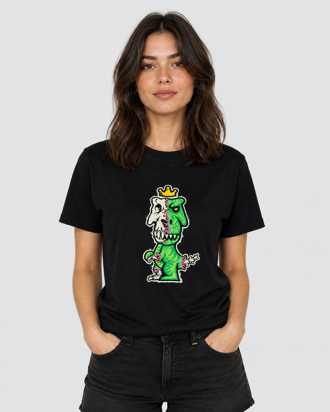 Woman wearing black Regno T-Rex Osium pima cotton graphic tee with neon green skeleton T-Rex design, female lifestyle shot