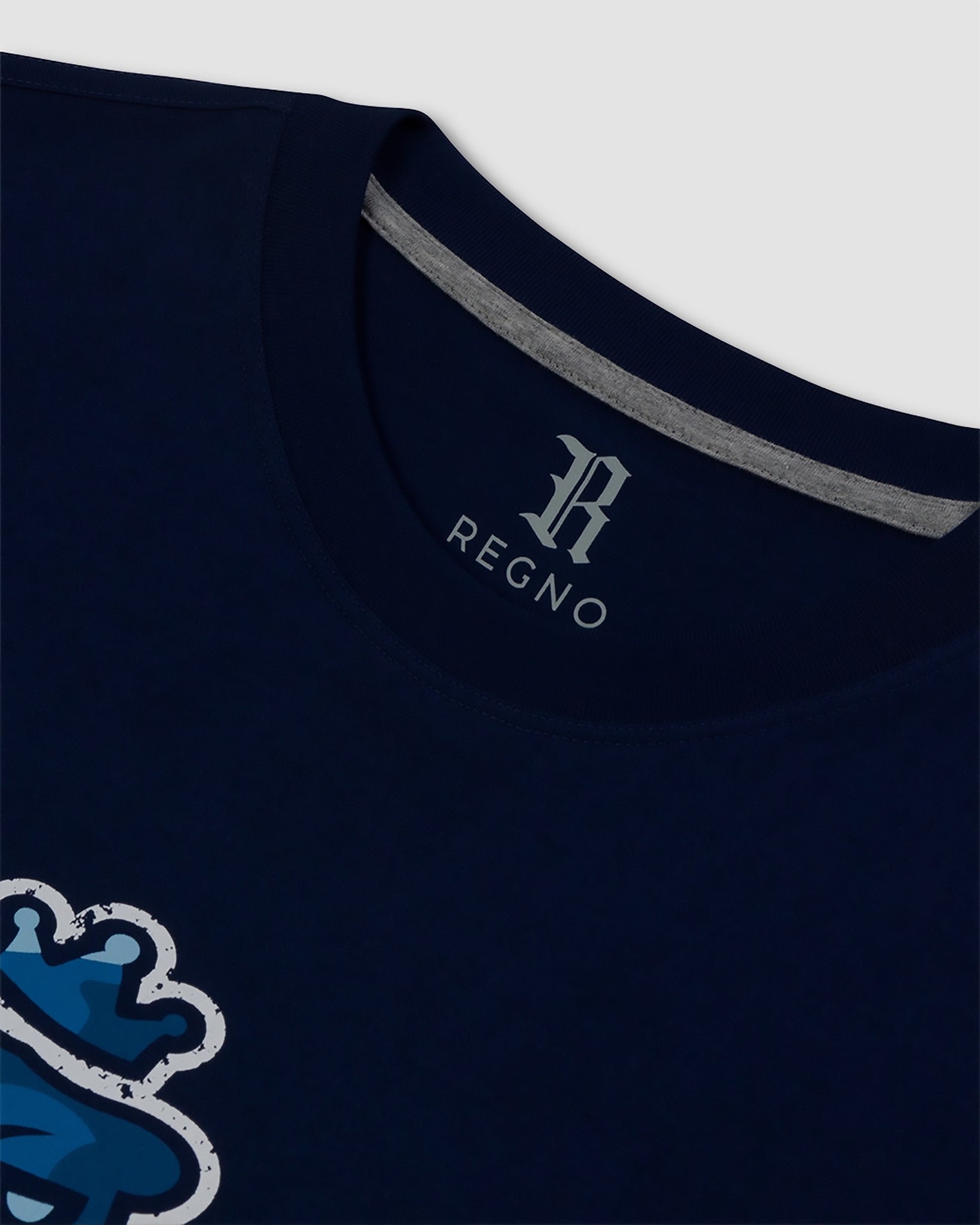 Close-up of luxury blue camo T-Rex graphic on navy pima cotton t-shirt by Regno, detail shot